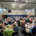 Seniors of Holy Name of Jesus Cathedral enjoying hamburgers and hot dogs prepared by Council 2546 in Raleigh.